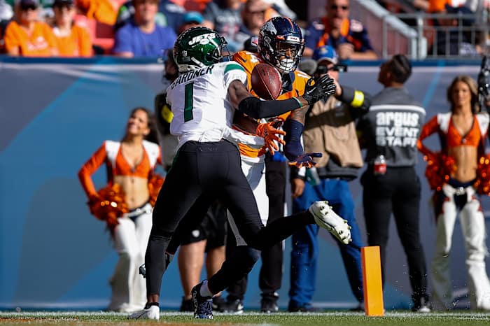 Oct 23, 2022; Denver, Colorado, USA; New York Jets cornerback Sauce Gardner (1) breaks up a pass intended for Denver Broncos wide receiver Courtland Sutton (14) in the second quarter at Empower Field at Mile High. Mandatory Credit: Isaiah J. Downing-USA TODAY Sports
